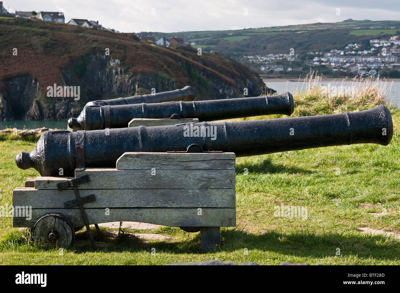 Canons on the headland at Fishguard harbour in Pembrokeshire, Wales. Location of the 'last invasion of Britain'. Stock Photo