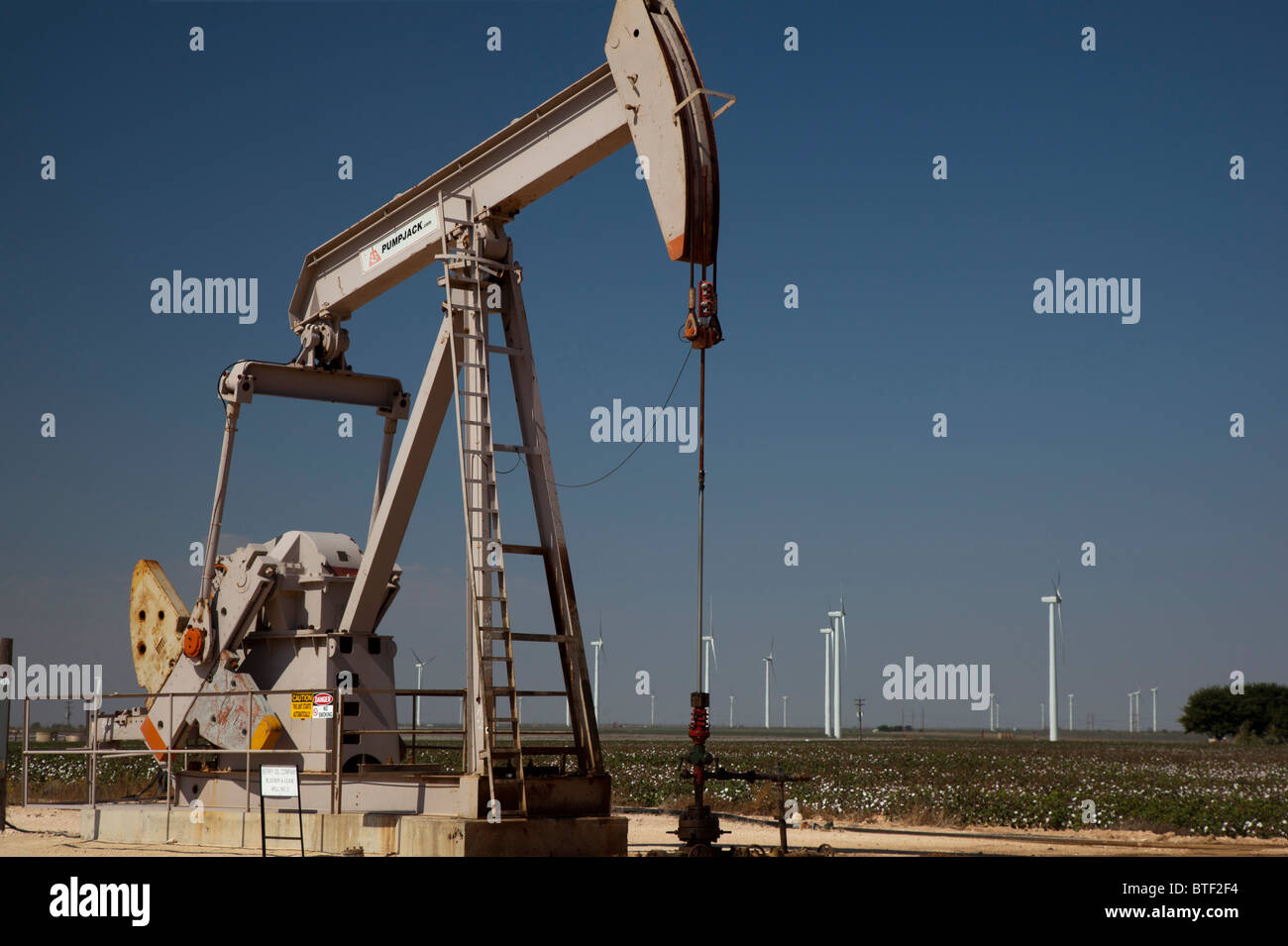 Stanton, Texas - An oil well and wind turbines in west Texas. Stock Photo