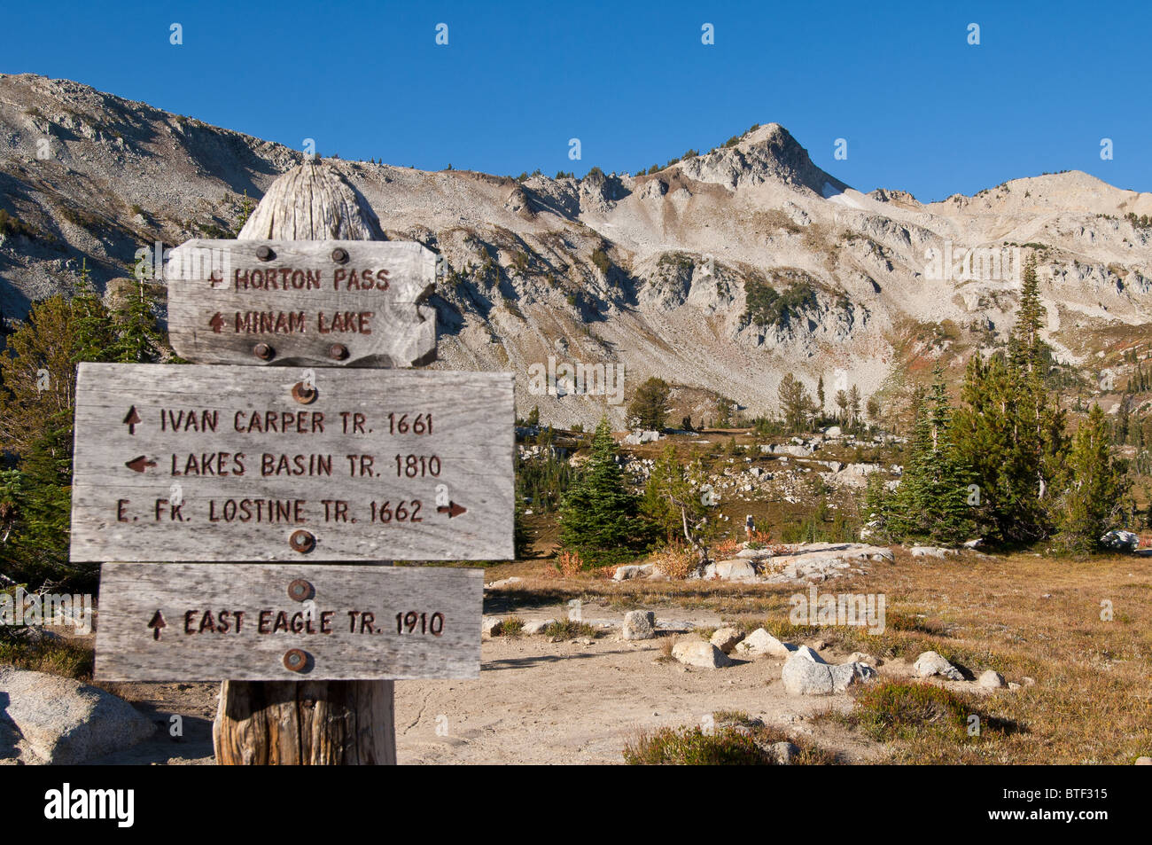 Sign at junction of Lostine River Trail, Lakes Basin Trail and East Eagle Trail; Eagle Cap Wilderness, Wallowa Mountains, Oregon Stock Photo