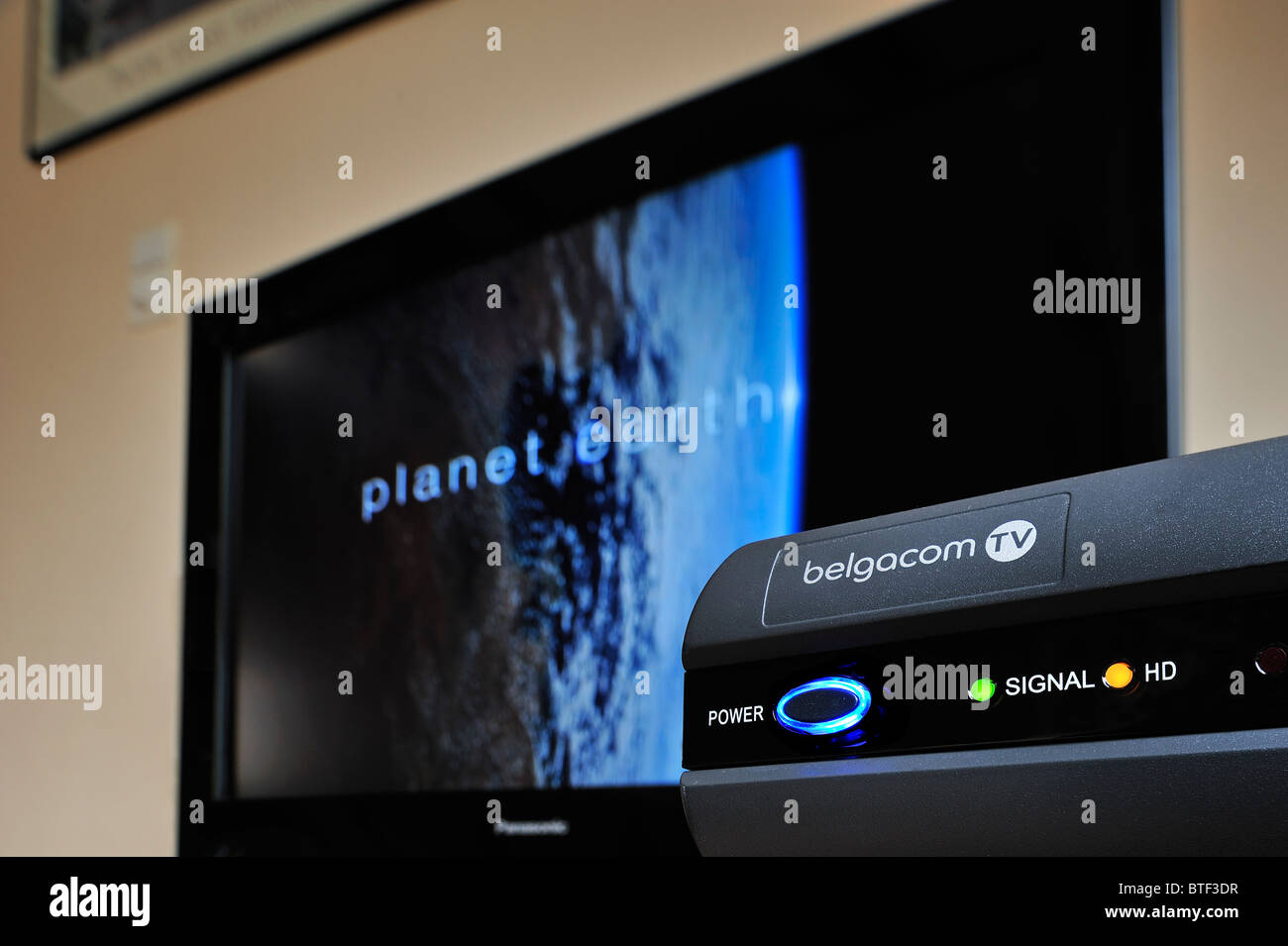 Standby lights from modem for digital flatscreen television Stock Photo