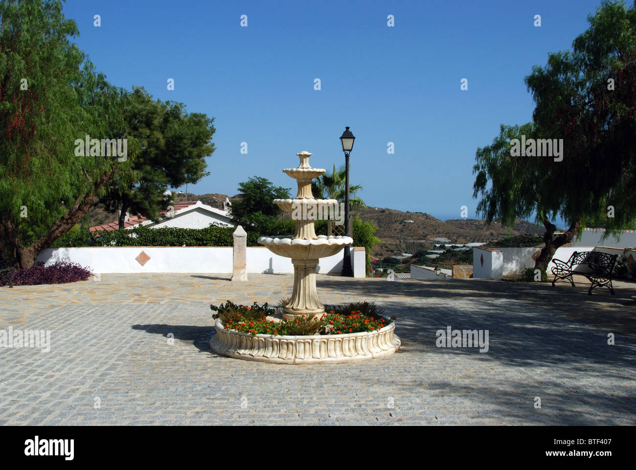 Fountain in a small plaza, whitewashed village (pueblo blanco), Macharaviaya, Costa del Sol, Malaga Province, Andalucia, Spain. Stock Photo