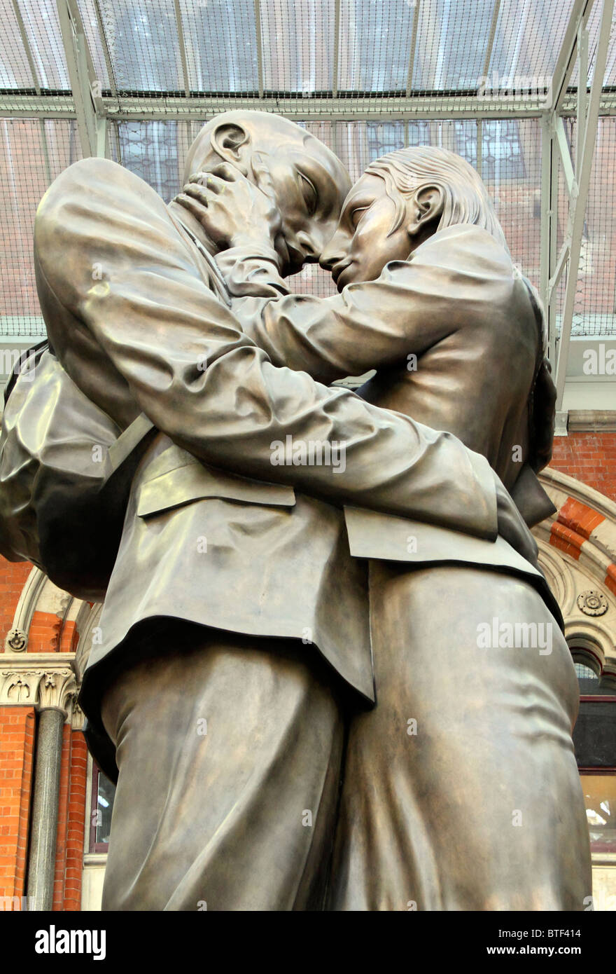 Young couple embracing, Meeting Place Sculpture by Paul Day, St
