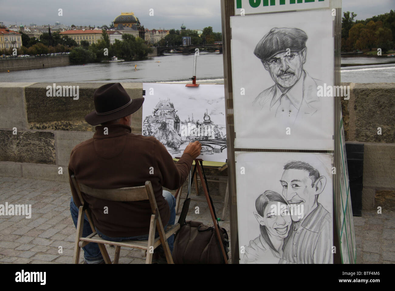 Portrait artist on Charles Bridge Prague Praha Stock Photo