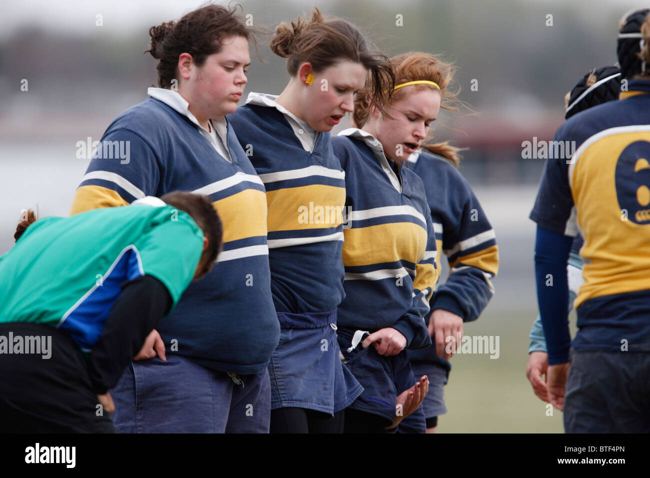 George Washington University players set for a scrum during a women's rugby match against the Naval Academy. Stock Photo