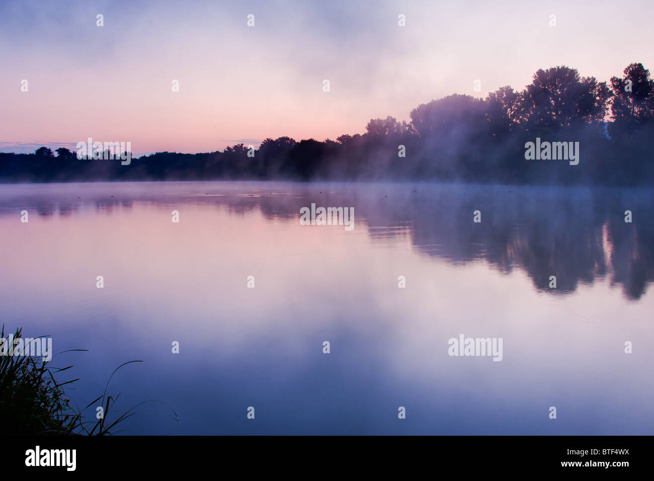 sunrise at a lake on a cold morning Stock Photo