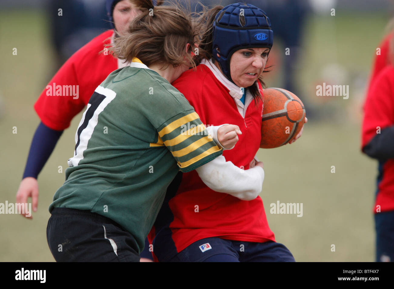 An American University player carries the ball against William and Mary during a women's rugby match. Stock Photo