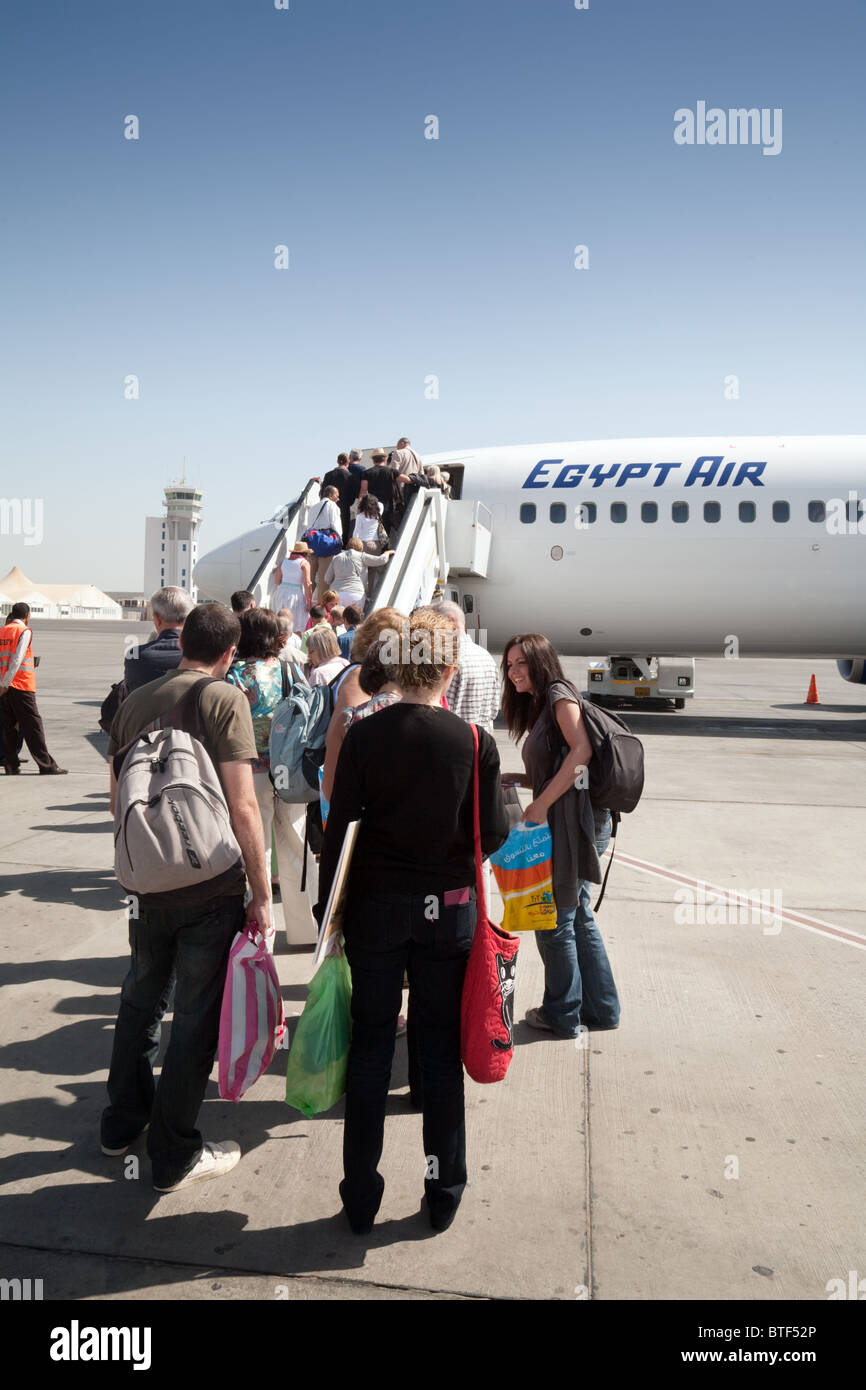 Western tourists boarding an Egyptair plane at Luxor airport, upper Egypt Egypt Africa Stock Photo