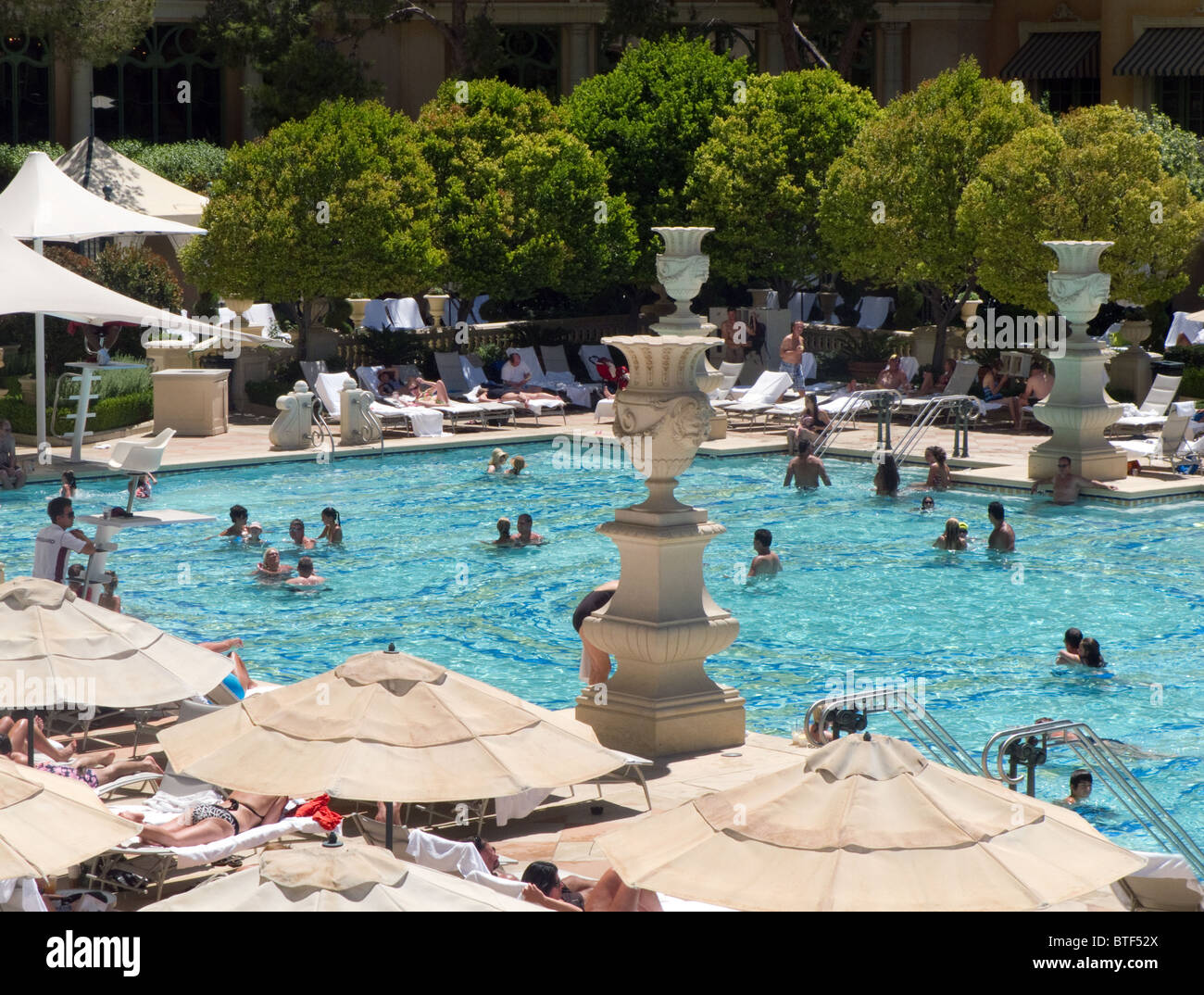 guests enjoying the swimmng pool at the luxury Bellagio Hotel, Las