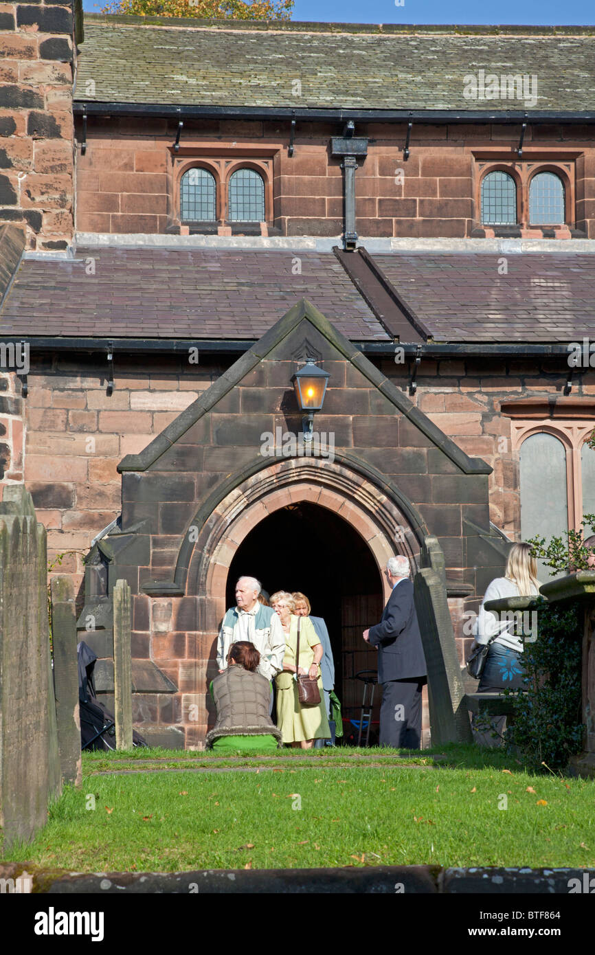 Congregation leaving St Wilfrid's Church, Grappenhall, Cheshire Stock Photo