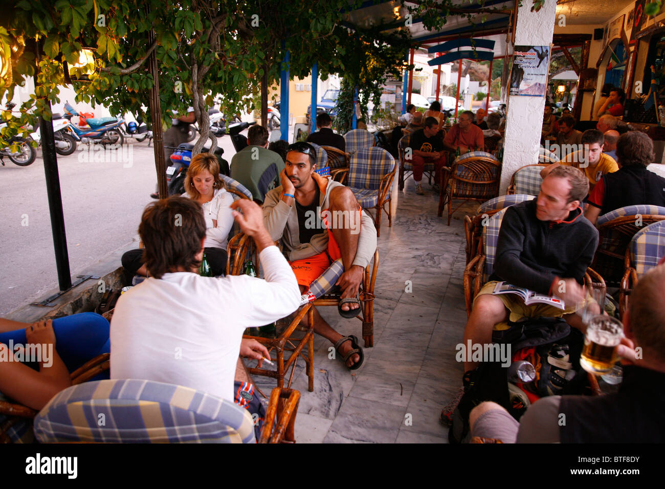 People sitting at a cafe in Massouri, Kalymnos, Greece, Stock Photo