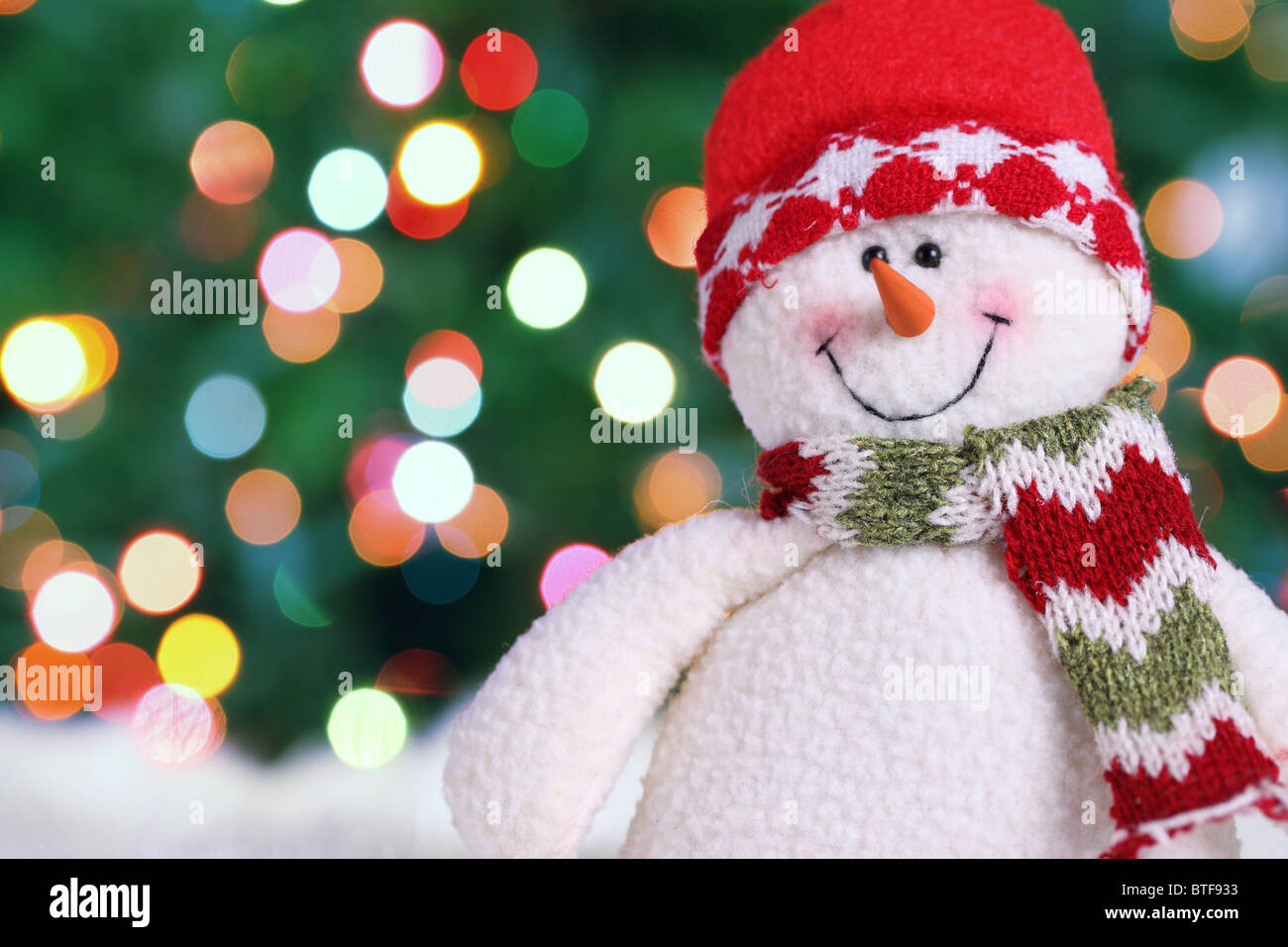 Festive snowman with Christmas light background Stock Photo