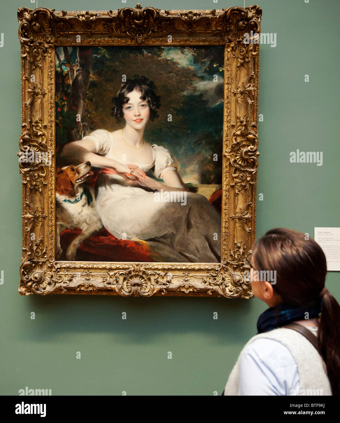 Woman looking at painting of Lady Somerville by Sir Thomas Lawrence at Metropolitan Museum of Art in Manhattan , New York City, Stock Photo