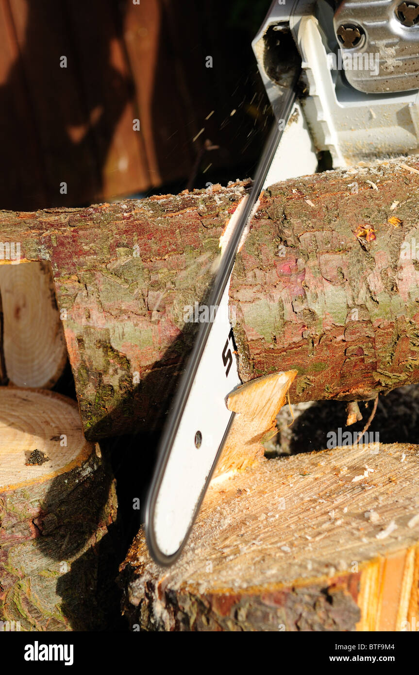 Stihl Chainsaw Cutting Log's Stock Photo - Alamy
