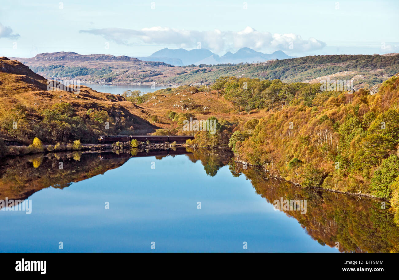 The Royal Scotsman train passes Loch Dubh at Polnish near Lochailort West Highlands of Scotland from Mallaig to Fort William Stock Photo