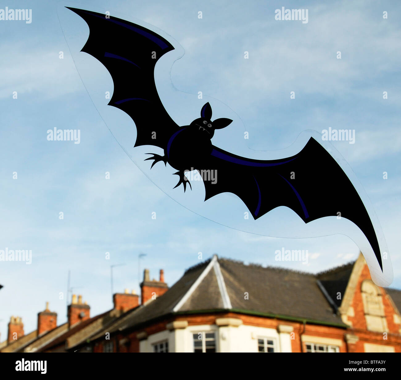 A bat sticker on a window at Halloween in Rothwell, Northants., UK. Stock Photo