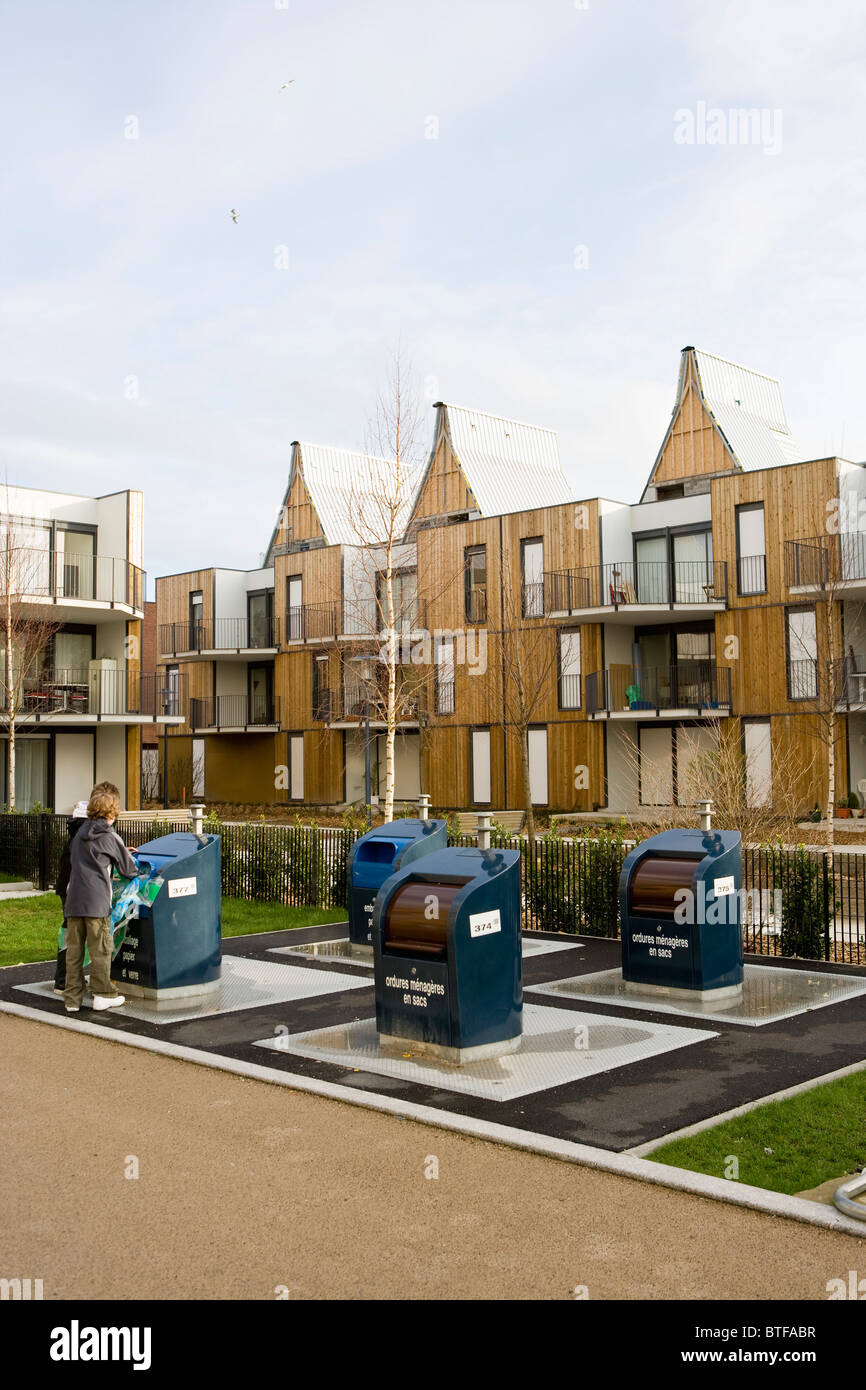 Recycling bins in front of apartment buildings Stock Photo Alamy