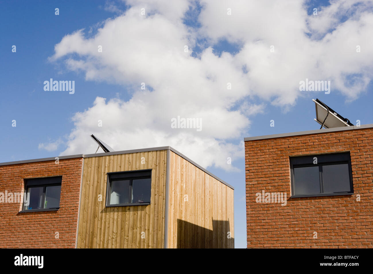 View of Apartment buildings with solar panels Stock Photo - Alamy