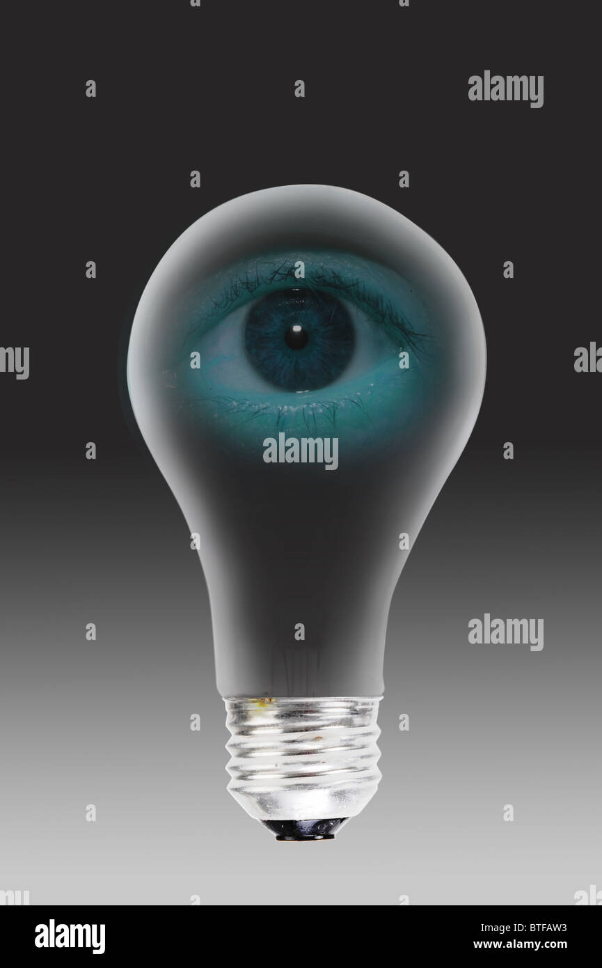 Eye in the light bulb. Stock Photo