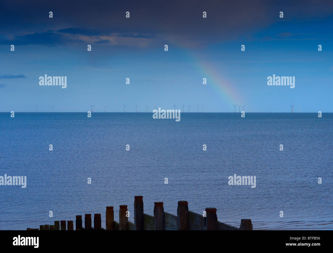 Rainbow over a wind farm off Whitstable Kent UK Stock Photo Alamy