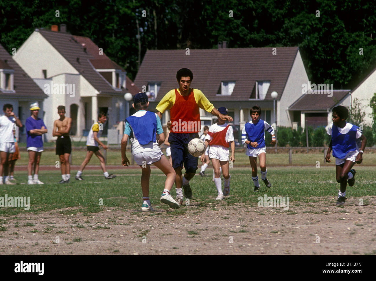 French students, gym class, playing soccer, soccer player, soccer