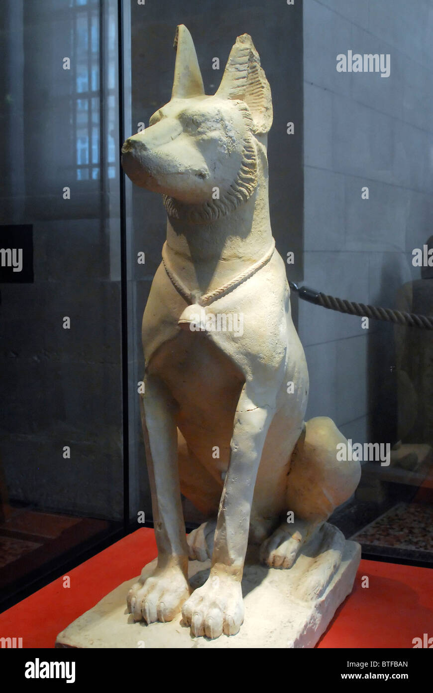 Ancient Egyptian dog statue. Louvre Museum Stock Photo