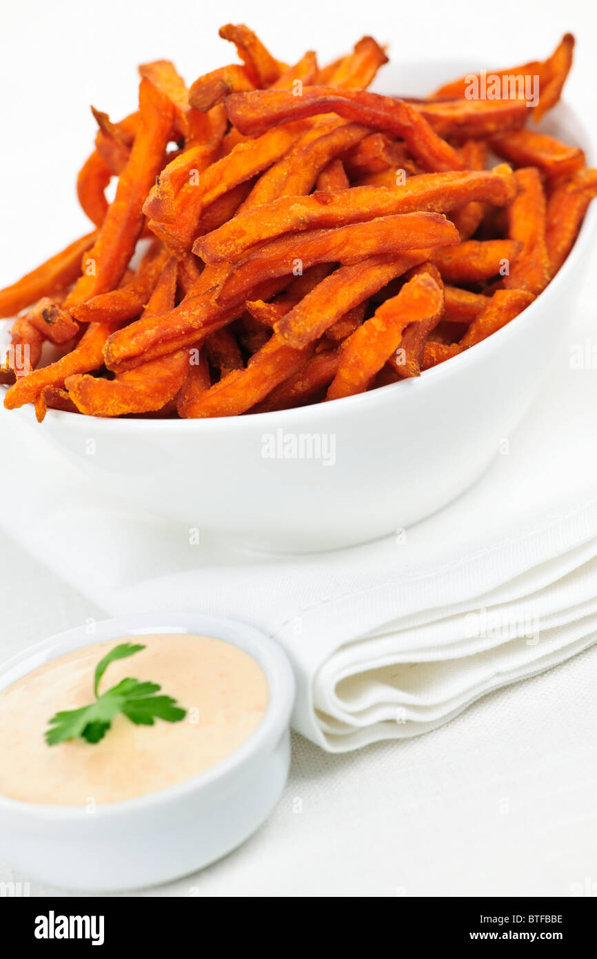 Bowl of sweet potato or yam fries with dipping sauce Stock Photo Alamy