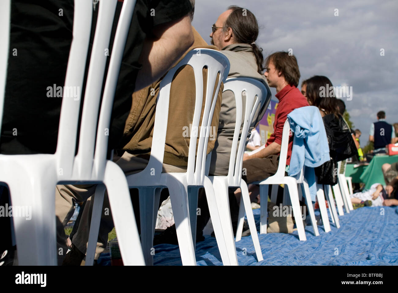 Rear view of an audience watching a concert at The Environmental Fair, Carshalton Park, London, 2010. Stock Photo