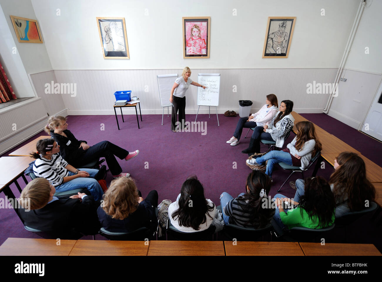 Etiquette teacher Lisa Shortland takes a class of overseas pupils at Downside Summer School, Somerset UK Stock Photo