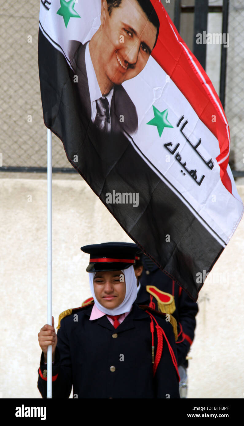 Two Palestinian children partake in the celebration for Bashar Al Assad, at the UNRWA school in al-Husseini refugee camp Stock Photo