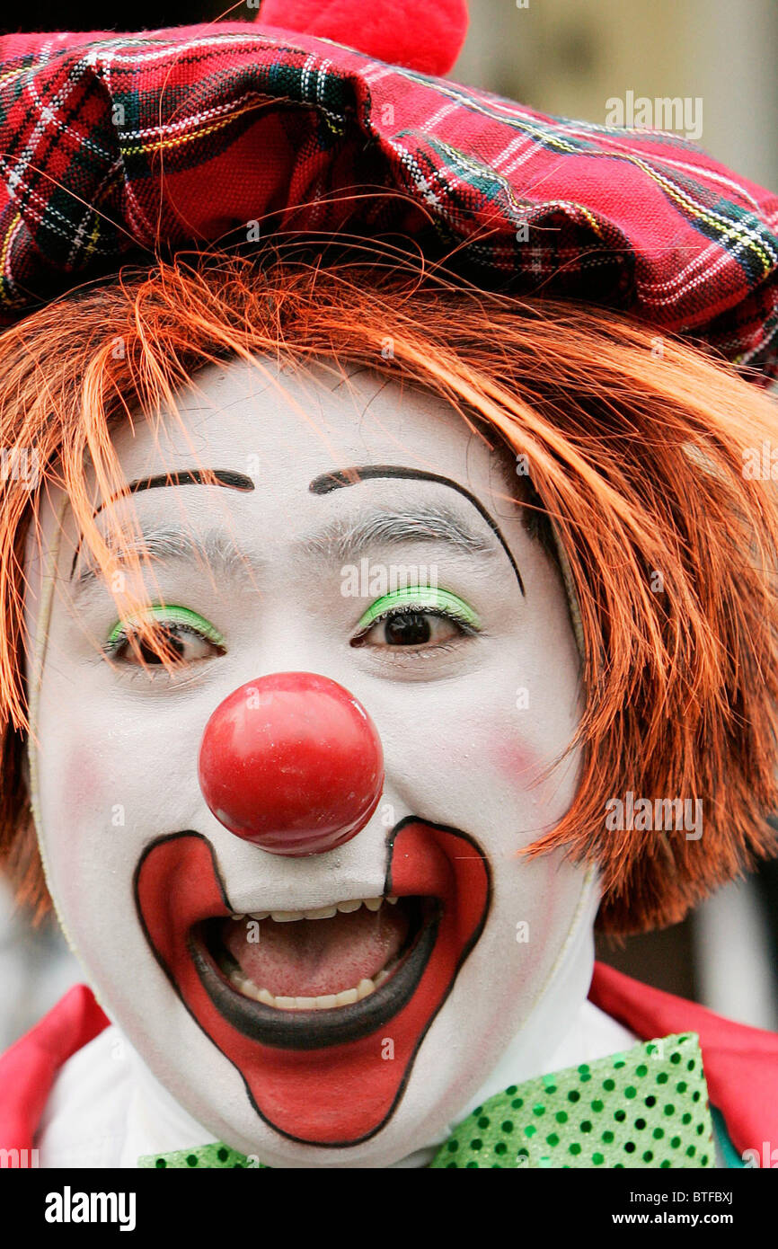 A clown street entertainer in Windsor, Berkshire, UK Stock Photo