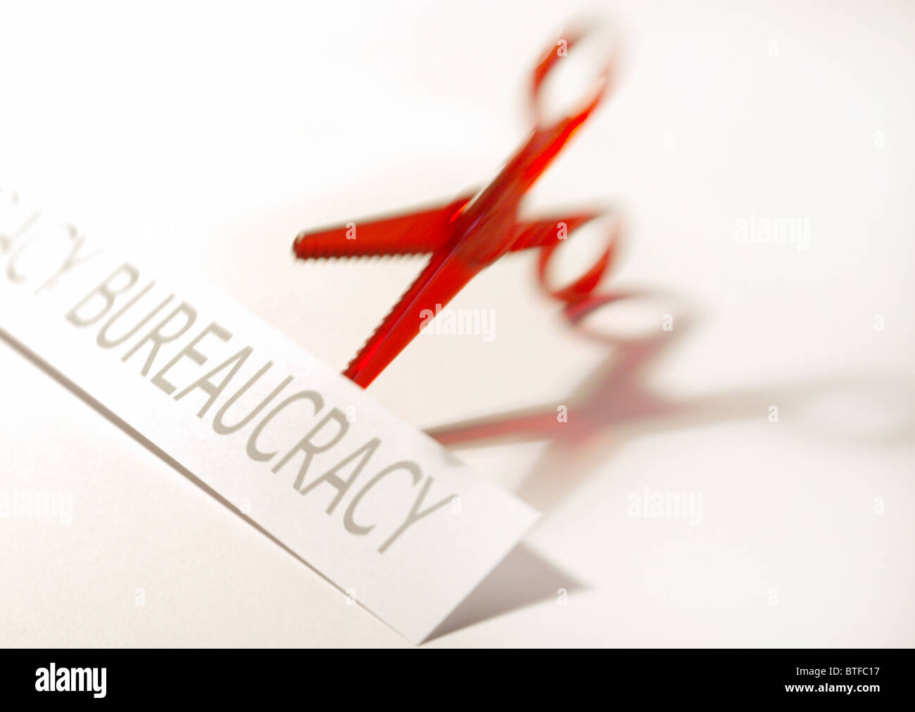 Brexit,Cutting bureaucracy (red tape) concept depicting red scissors