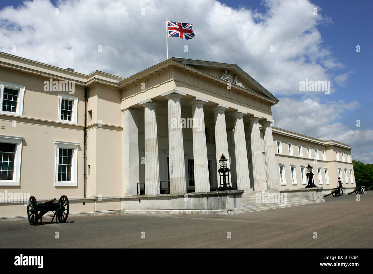 Sandhurst Royal Military Academy with Union Jack flag on flagpole, in Sandhurst, Surrey, United Kingdom Stock Photo