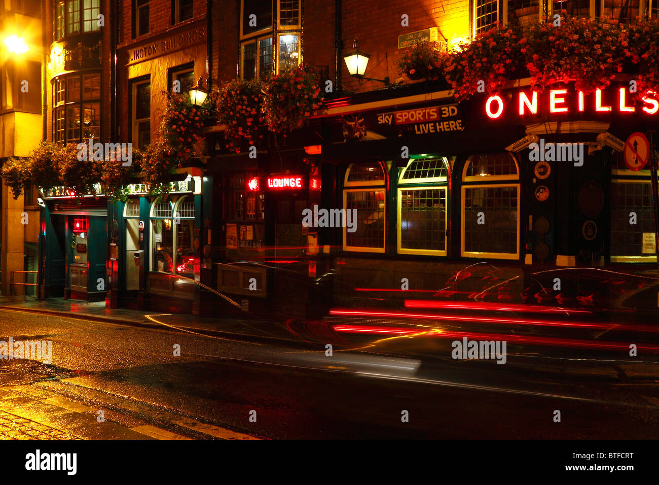 A nighttime view of the O'Neills Irish bar and restaurant, one of the famous Irish pubs in Dublin. Stock Photo