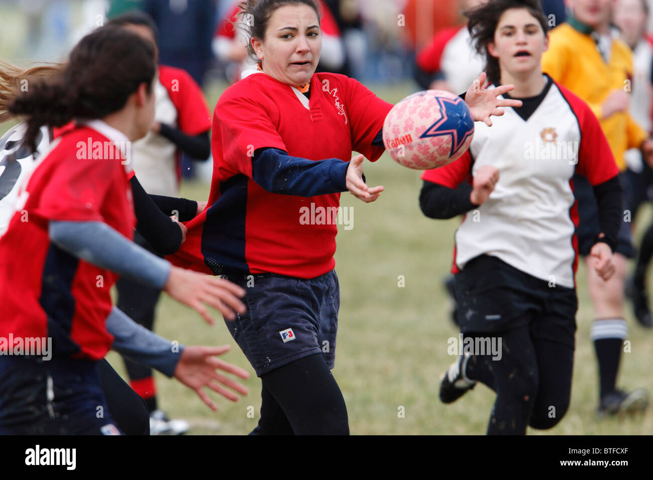 An American University player passes the ball against the University of ...
