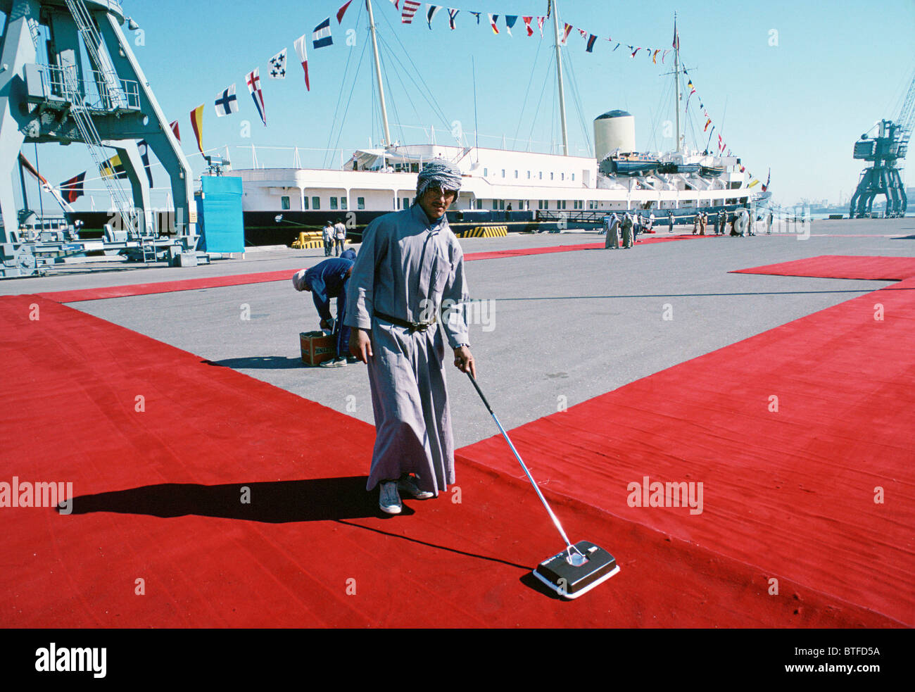 The red carpet being cleaned for VIP visit in Kuwait Stock Photo
