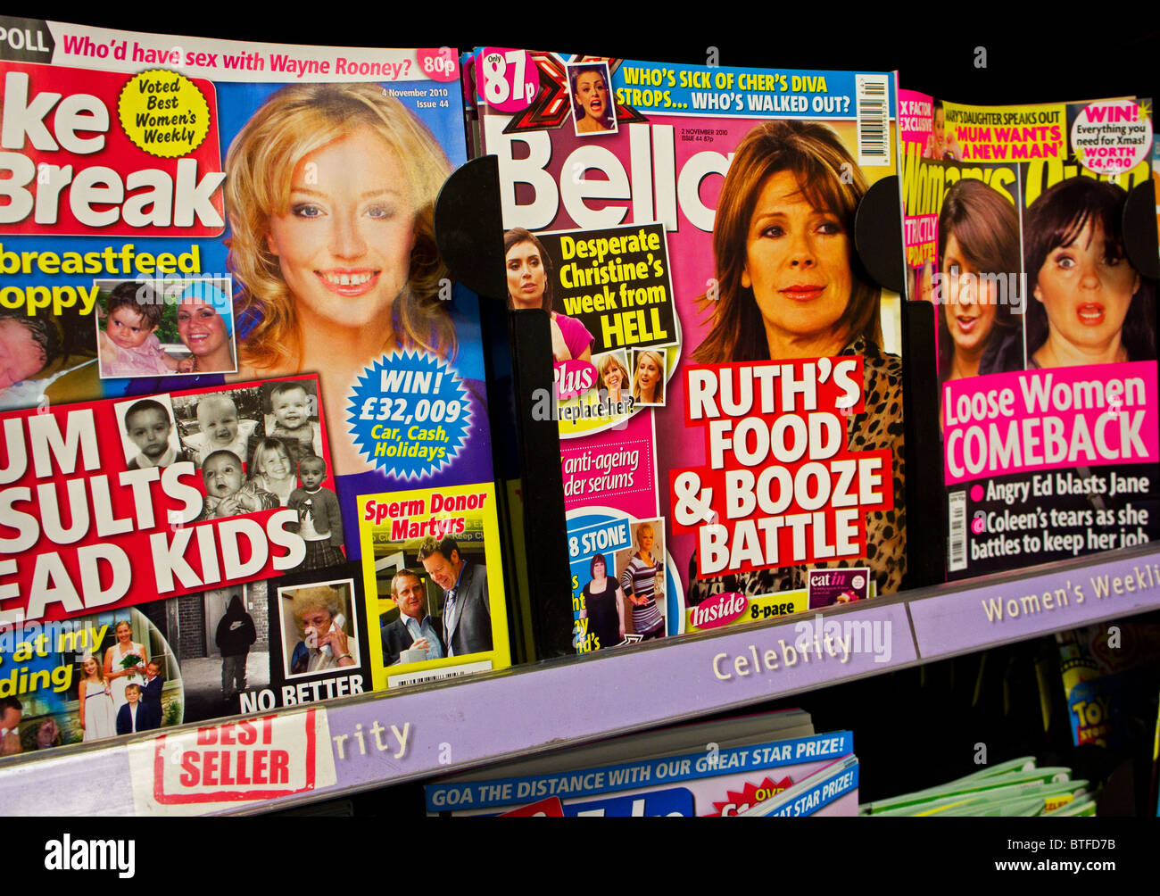 Consumer chat magazines for sale in a newsagents shop. Stock Photo