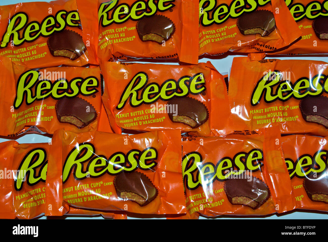 Packages of individual Hershey Reese chocolate peanut butter cup candy bars ready to hand out for Halloween Stock Photo