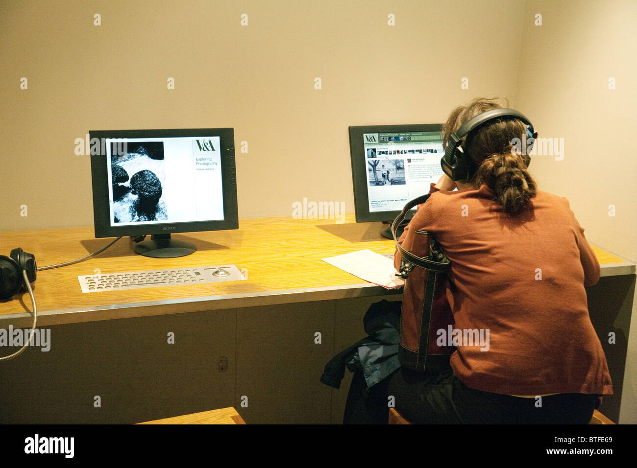 A teenager studying on the computer at the Victoria and Albert museum, London, UK Stock Photo