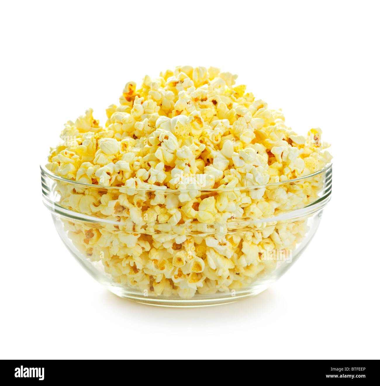 Bowl of fresh popped popcorn isolated on white background Stock Photo