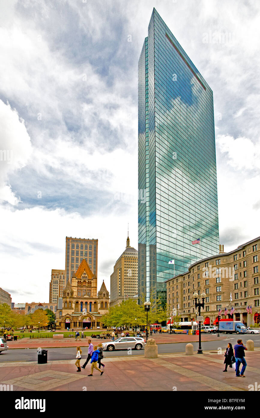 Boston's Copley Square in the city's Back Bay district. At left is Trinity Church. At right is the John Hancock Tower. Stock Photo