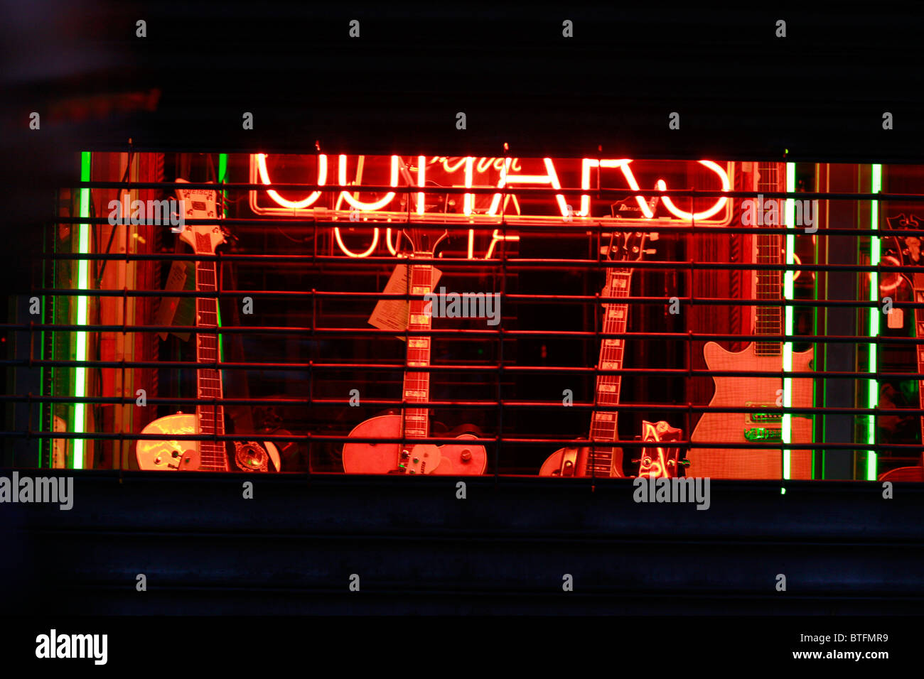 Guitar Shop in New York City, Manhattan with guitars in front and neon light Stock Photo