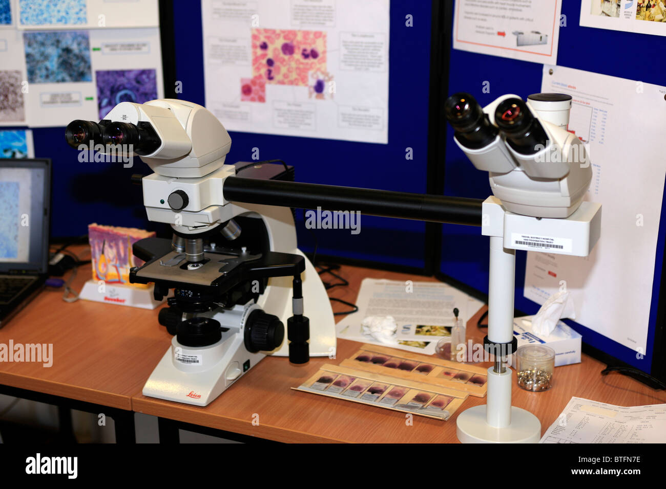 Blood analysis microscopes on display at a NHS hospital open day Stock