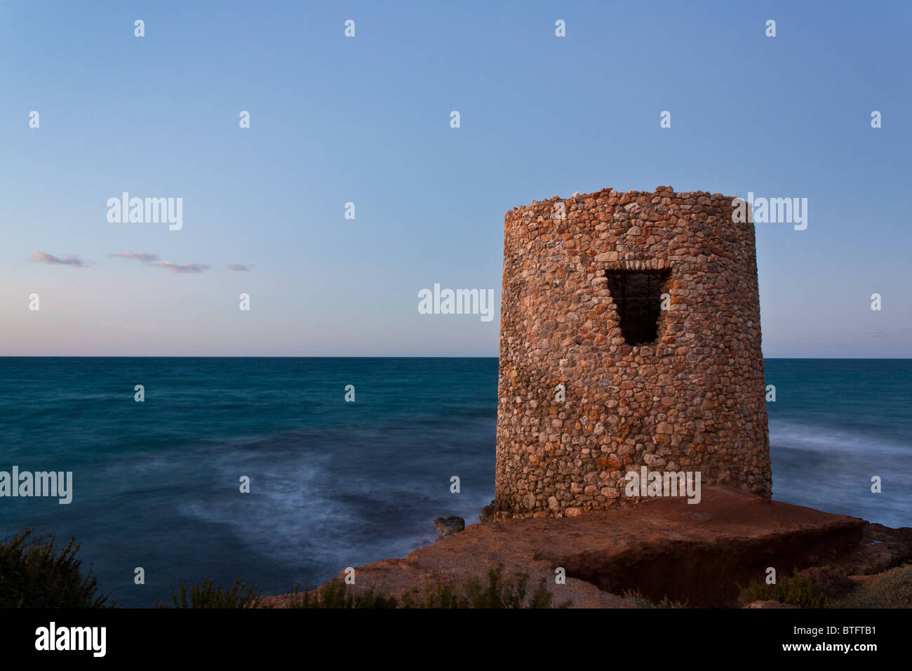 coastal guard tower at sunset Stock Photo