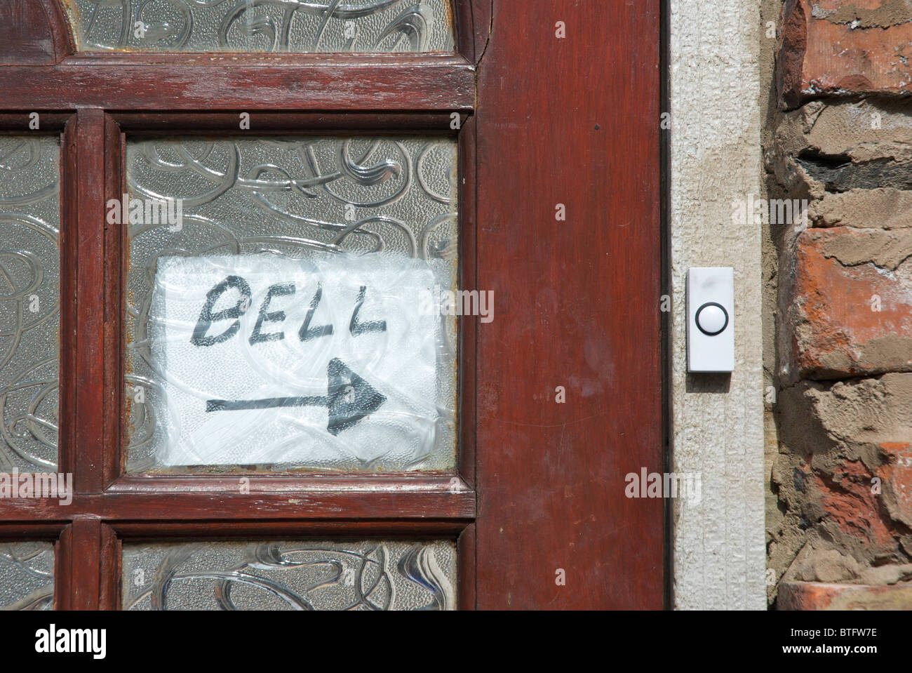 Bell push - and sign - on door Stock Photo