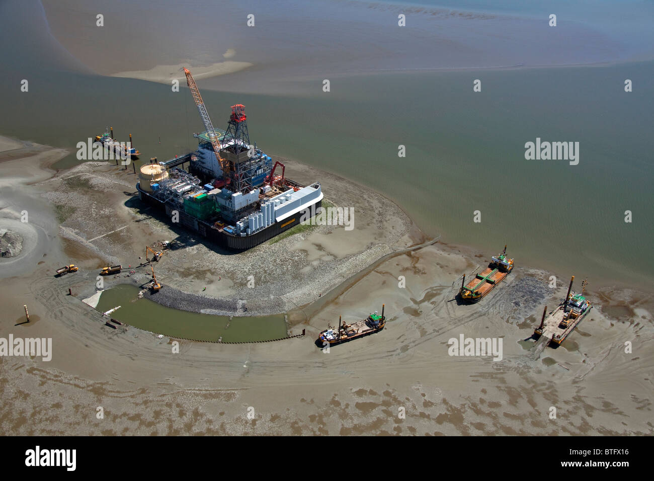 Oil rig and protection platform Mittelplate in the North Sea off Schleswig-Holstein, Germany. Stock Photo