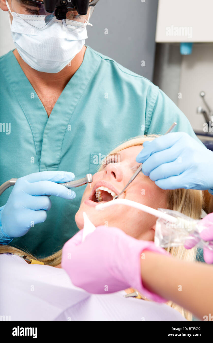A dentist working on a tooth at a dental clinic Stock Photo