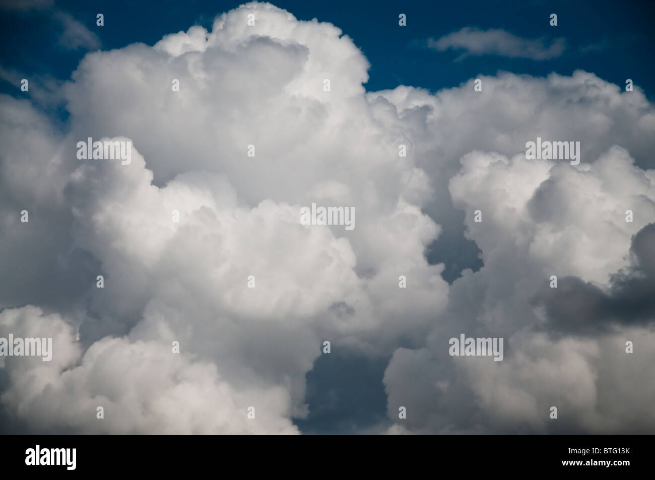 Fluffy white and grey clouds hi-res stock photography and images - Alamy