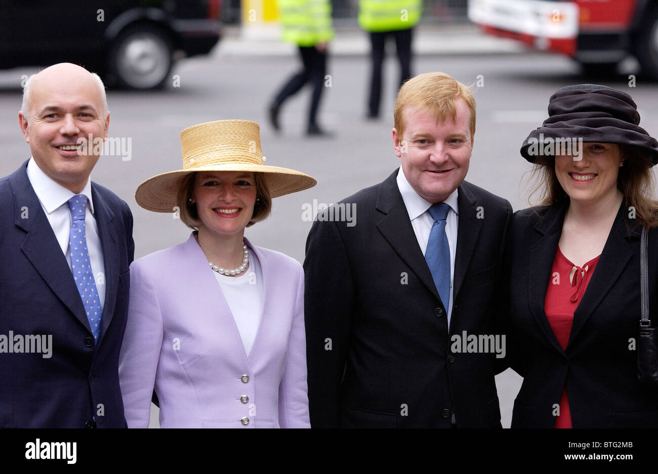 Conservative leader Iain Duncan Smith wife Betsy and Liberal Democrat leader Charles Kennedy and wife Sarah at Westminster Abbey Stock Photo