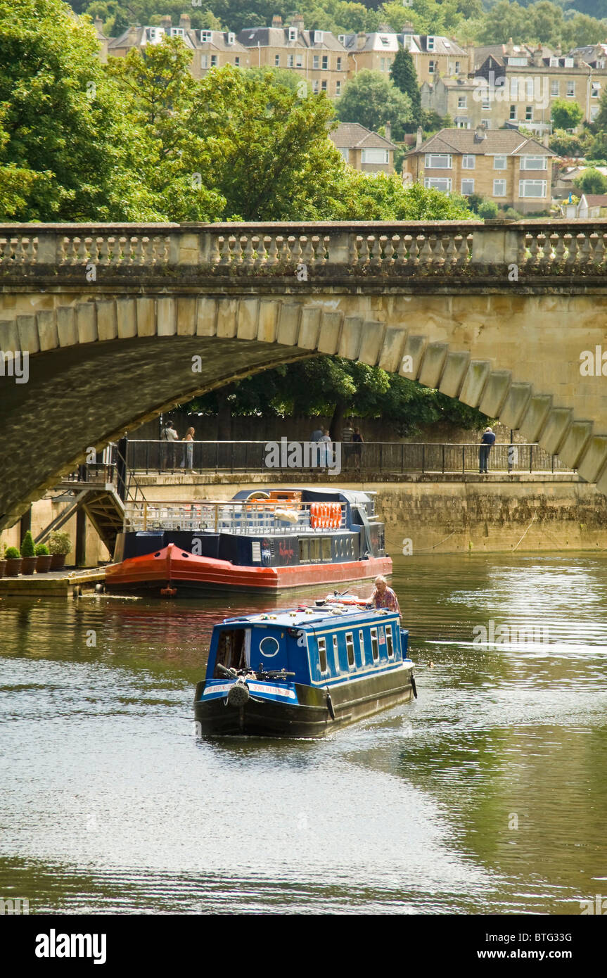 Vertical view across the river Avon in Bath with canal boats sailing