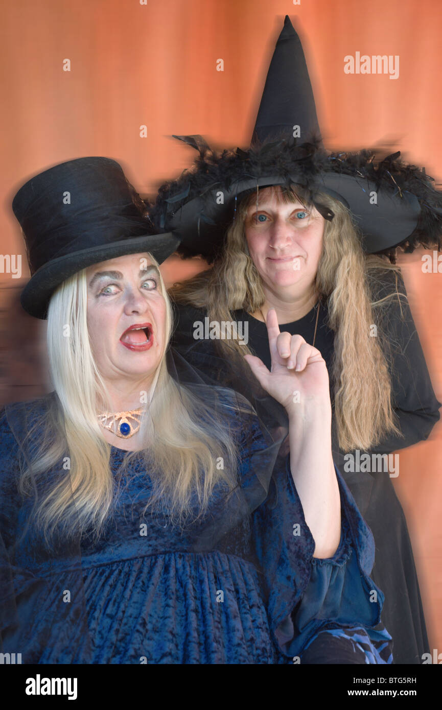 Two scary witches prepare to cast their spells on Halloween in Carrizozo, New Mexico. Stock Photo